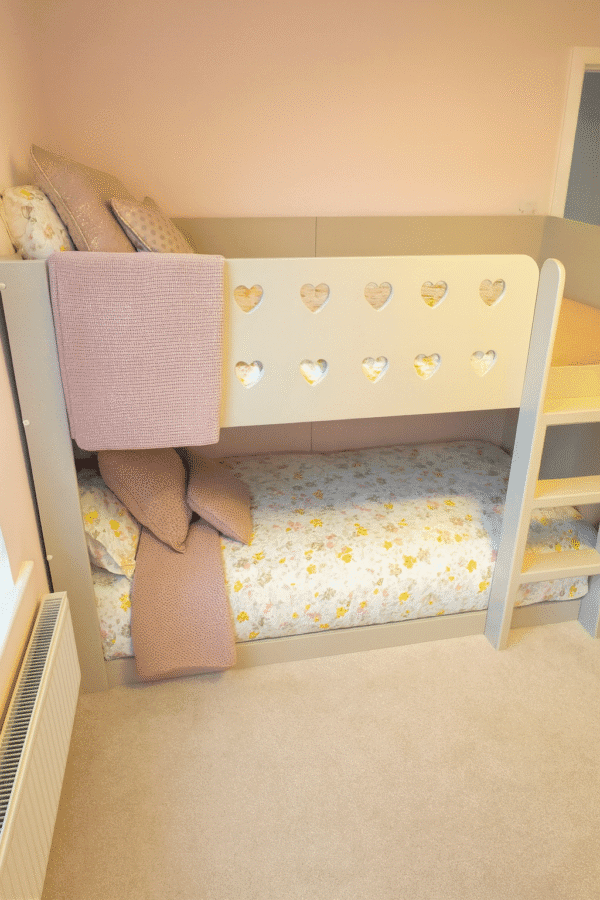 Standard bunk bed with ladder. heart cut outs on top rail.