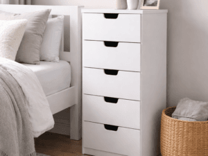 LUNA 5 Drawer Tallboy Storage Unit in white displayed in a modern bedroom with minimalist decor, showing the slim vertical design and five spacious drawers.