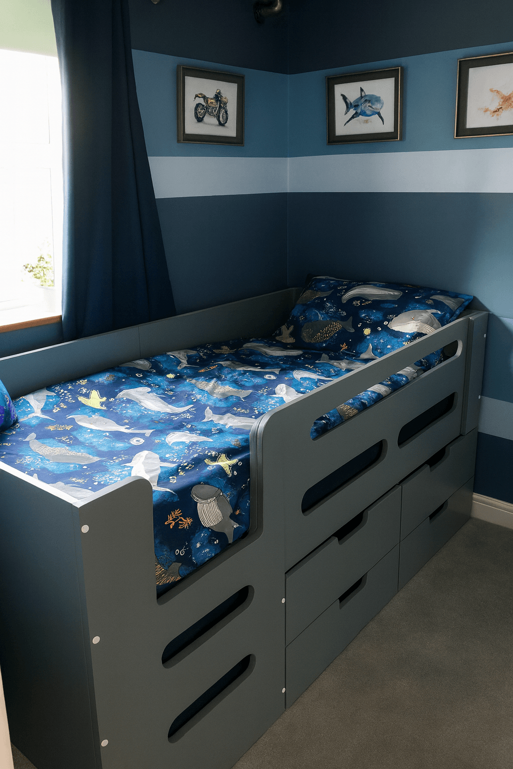 Grey Cabin bed with integrated drawers for storage.