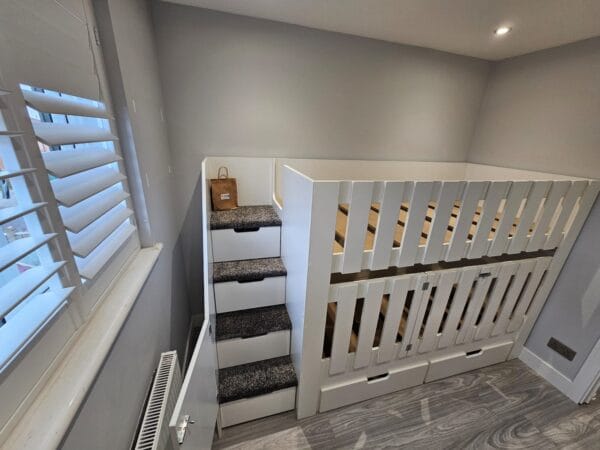 Bunk Bed with cot rail, drawers, stairs, carpet, stair gate.