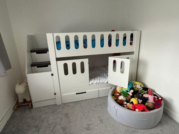 Bunk Bed with cot rail, drawers, stairs, carpet, stair gate.