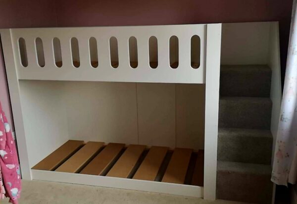 5ft high standard bunk bed with stair case. modern beds. funky bunk beds. carpet on the stairs. cut out top rail.