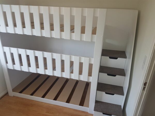 triple tier bunk. space saving. bunk bed. sleep 3. in white. stair case. drawers in the stairs. carpet on the stairs.