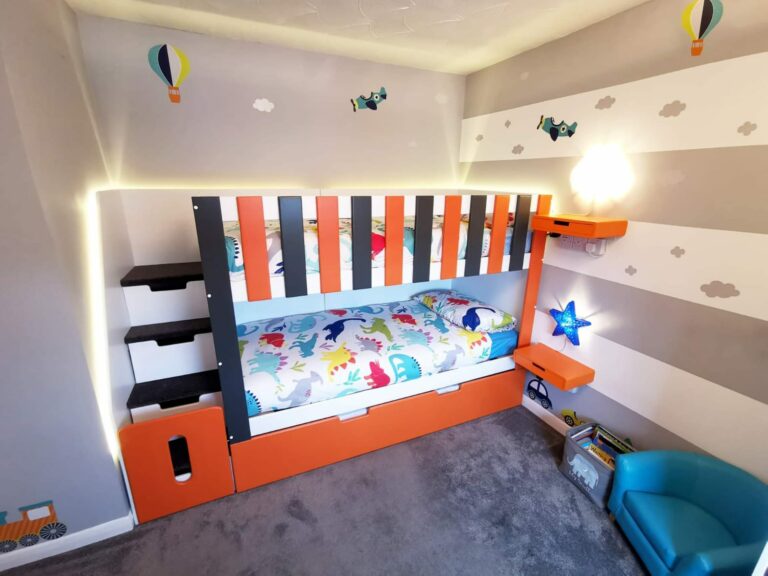 Funky Bunk Beds. Trundle Bunk bed in orange and black. pull out bed. gate on the stairs. drawers in the stairs. storage. triple sleeper. bespoke triple bunk