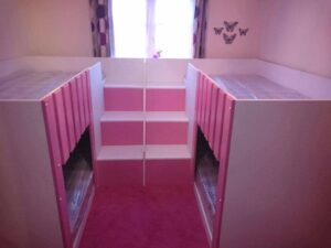 U shape quad sleeper. pink . space saving bunks. funky bunk beds.