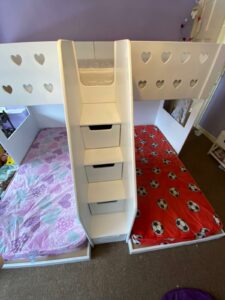 M Shape triple bunk. single mattress size. drawers in the stairs. stair case. carpet on the stairs. funky bunk beds