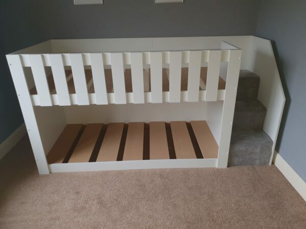 4ft high white bunk bed with stairs. latts on top safety rail. carpet on the stairs