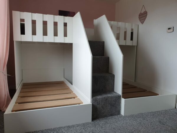 m shape triple bunk. carpet on the stairs. in white. stair case. single mattress 190cm x 90cm