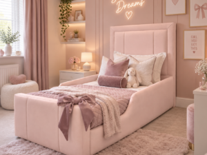 3 Panel Stylo Kids Fabric Bed in blush pink, styled in a modern pink girls bedroom with soft bedding and bow detail.