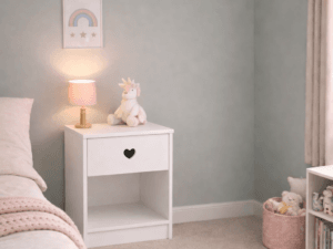White Sweetheart bedside cabinet with heart-shaped handle in a modern children’s bedroom, styled with a lamp, soft toys, and pastel decor for a cosy and stylish look.